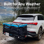 A black and blue Rockins car trailer hitch bag mounted on the hitch of a white Audi Q3, shown on a muddy forest road with the text 'Built for Any Weather' at the top.
