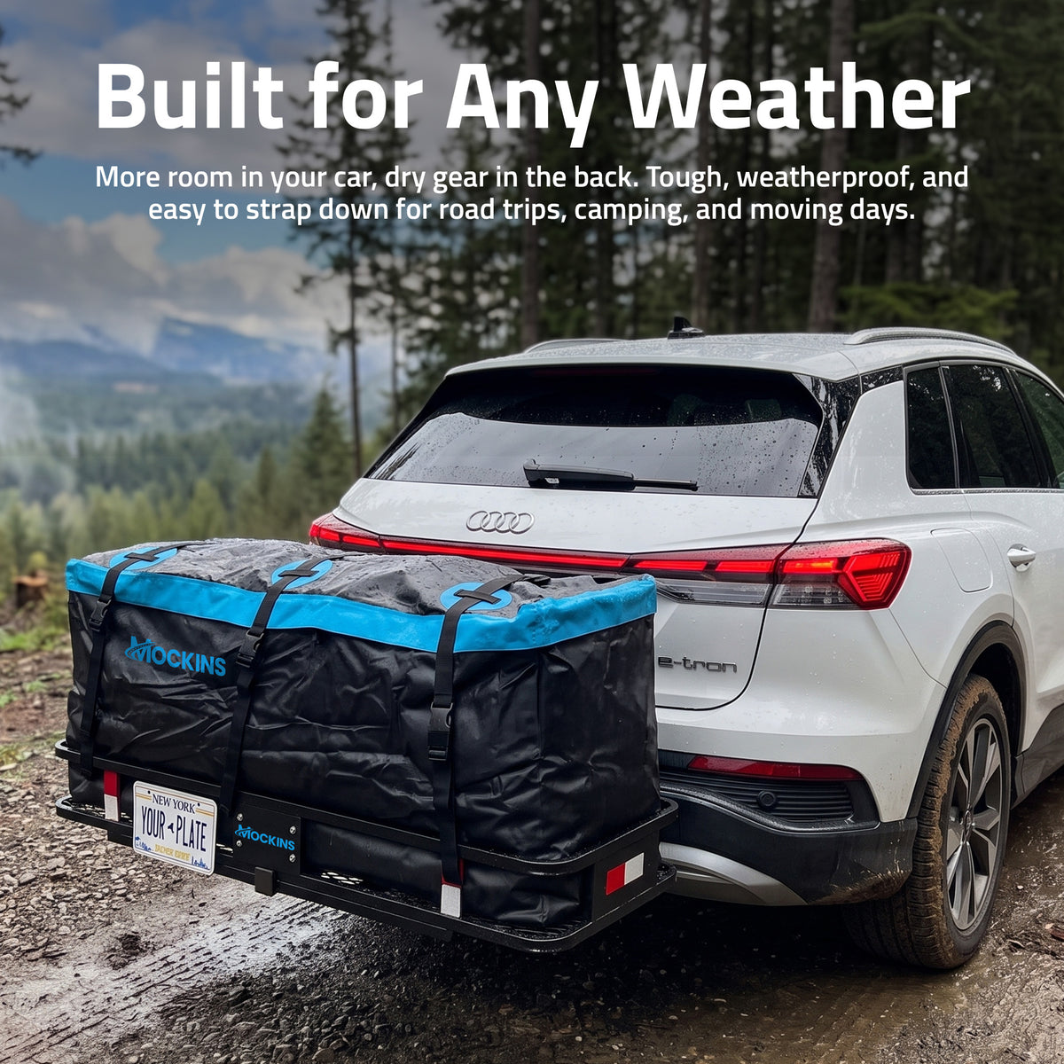 A black and blue Rockins car trailer hitch bag mounted on the hitch of a white Audi Q3, shown on a muddy forest road with the text 'Built for Any Weather' at the top.