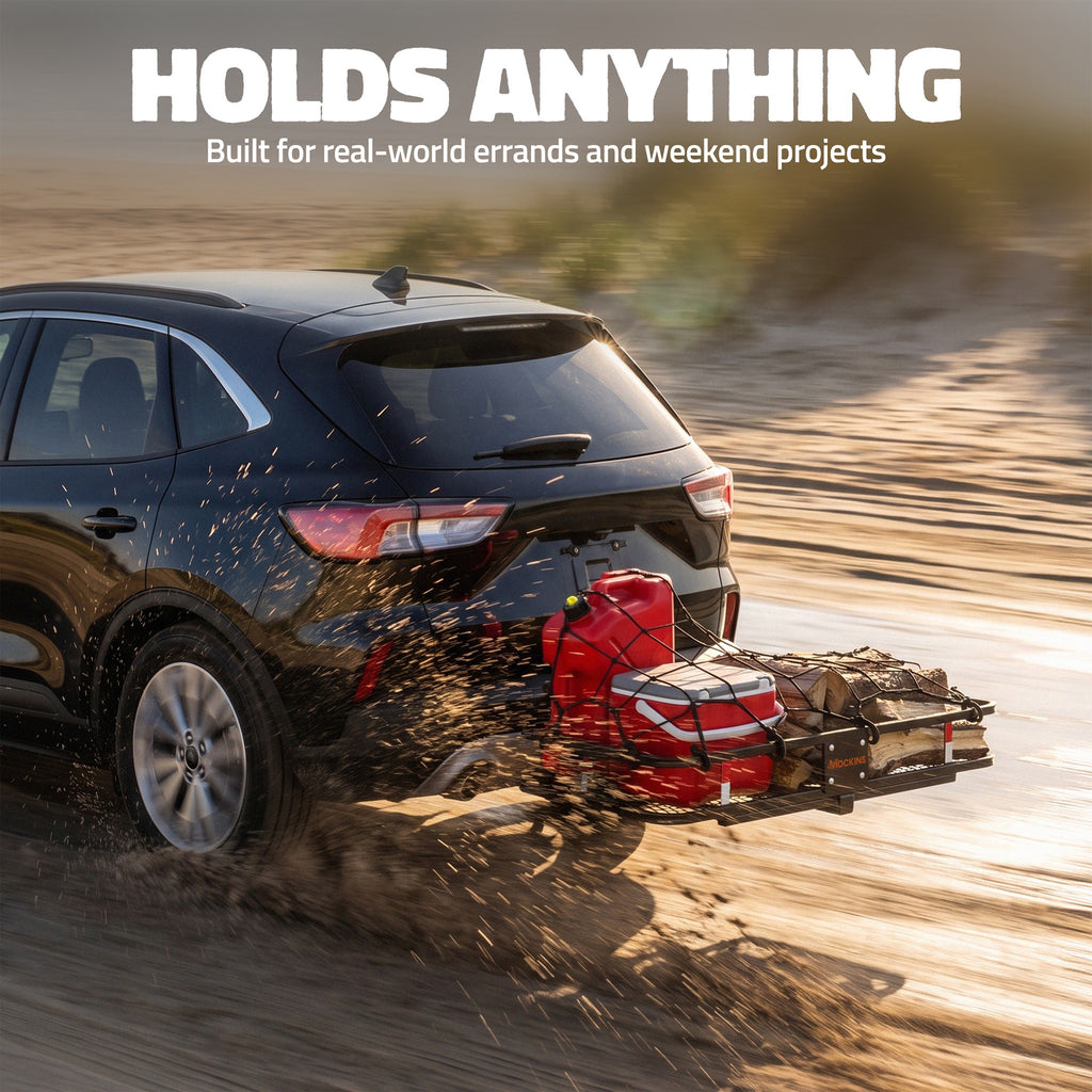 A black SUV driving on a dirt road while towing a large black trailer loaded with a red fuel canister and other gear. Large white text at the top reads 'HOLDS ANYTHING' with smaller text below, 'Built for real-world errands and weekend projects.
